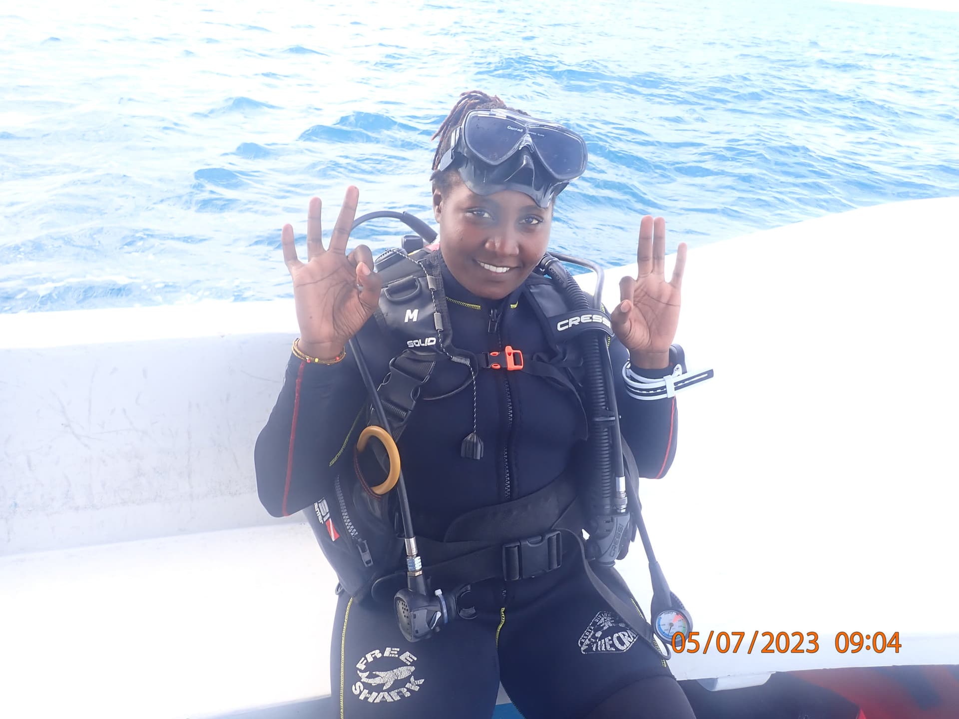Diana Kerubo Nyakundi, a marine biologist with ORP Kenya, in her diving gear before heading out to document sea turtles along Kenya’s coast. [Courtesy: ORP Kenya]